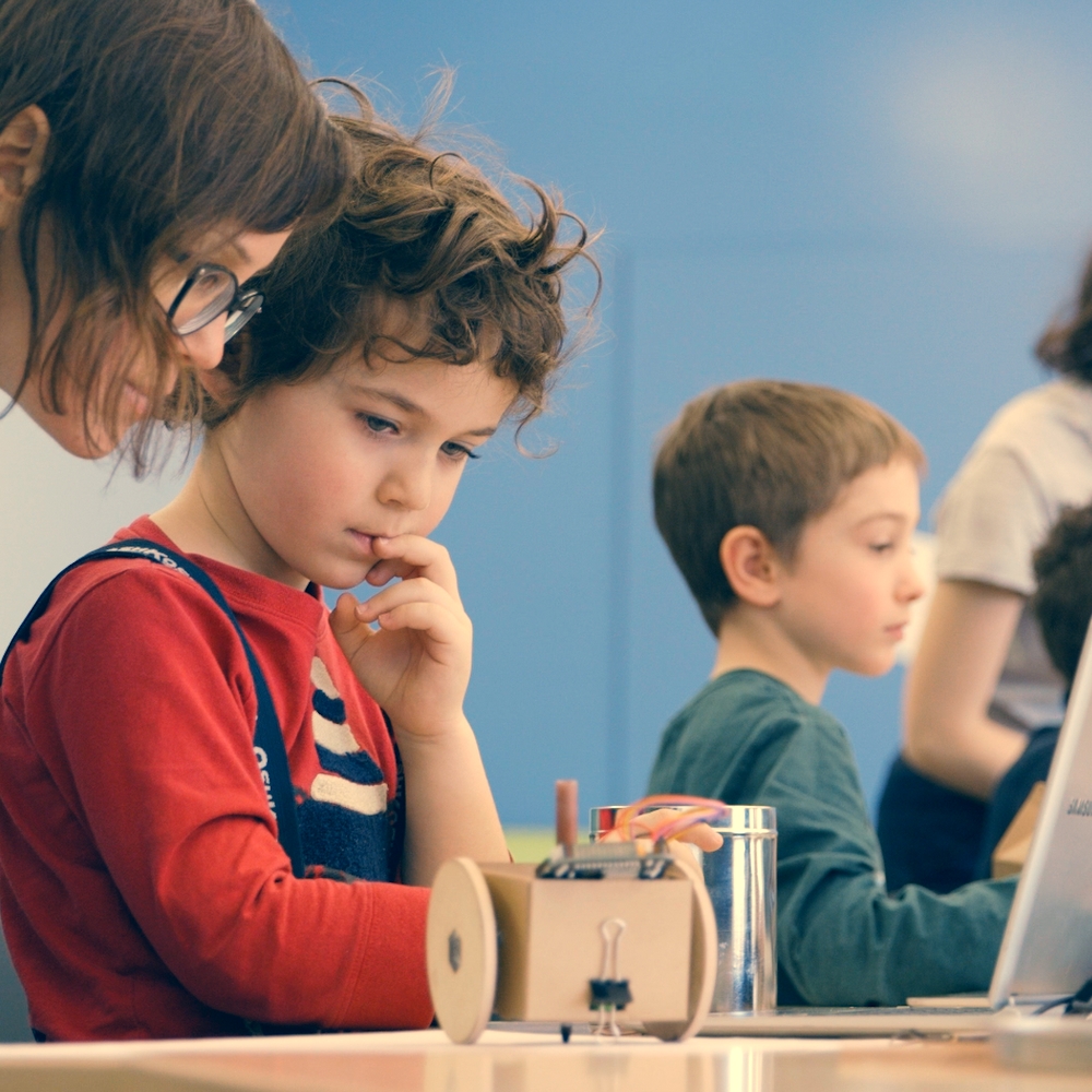 Students working together with a Robot In A Can activity